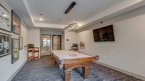 a living room filled with furniture and a wood floor